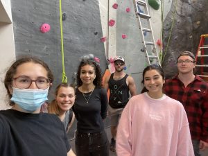 6 individuals at a climbing wall