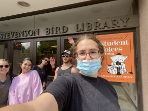 5 individuals outside Bird Library at S.U.