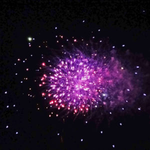 fireworks exploding purple and red